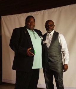 left, Clando Brownlee, Jr, received honor as Climate Luminary from GL Hodge, co-chair of the San Francisco Interfaith Council and CIPL Steering Committee member